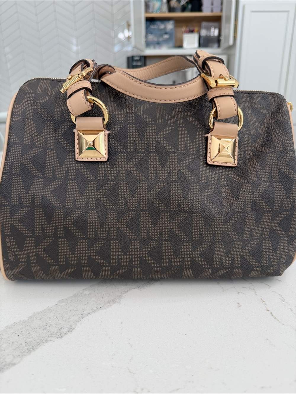 Michael Kors Grayson Medium Satchel featuring gold-tone stud and chain hardware.